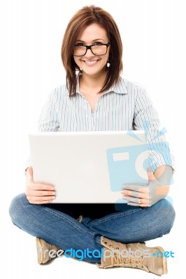 Casual Woman Working On A Laptop Stock Photo