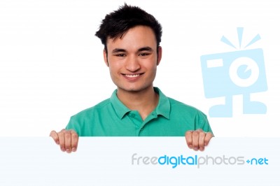 Casual Young Boy Holding Blank Whiteboard Stock Photo