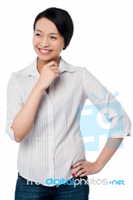 Casual Young Chinese Girl Looking Away Stock Photo