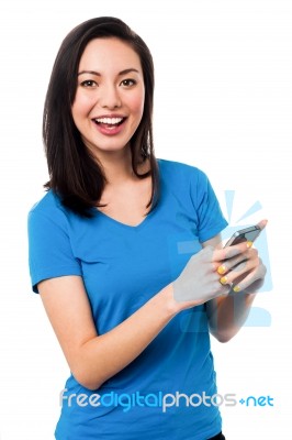 Casual Young Woman Using Smart Phone Stock Photo