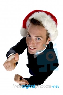 Caucasian Businessman With Cheerup And Santa Cap Stock Photo