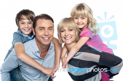 Caucasian Family Of Four In The Studio Stock Photo