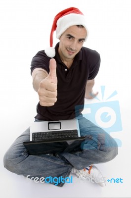 Caucasian Man With Laptop And Christmas Hat Stock Photo