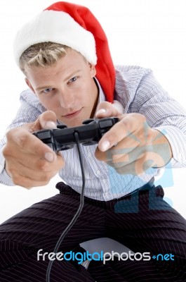 Caucasian Man With Remote And Christmas Hat Stock Photo