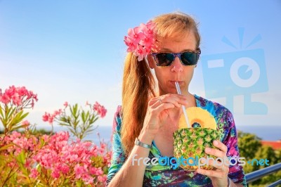 Caucasian Woman Drinking Pine Apple Juice Stock Photo