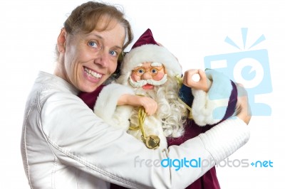 Caucasian Woman Embracing Model Of Santa Claus Stock Photo