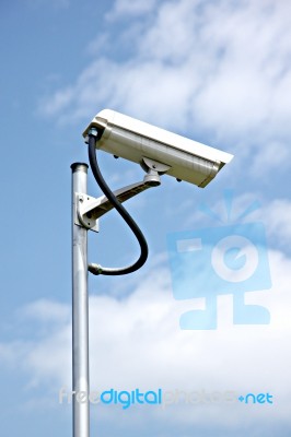 Cctv Camera On Blue Sky Background Stock Photo