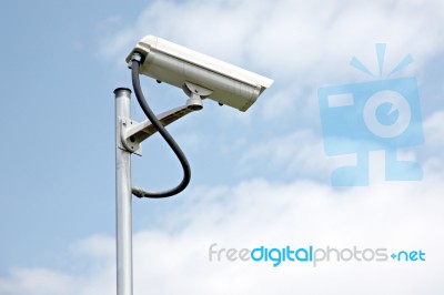 Cctv Camera On Blue Sky Background Stock Photo