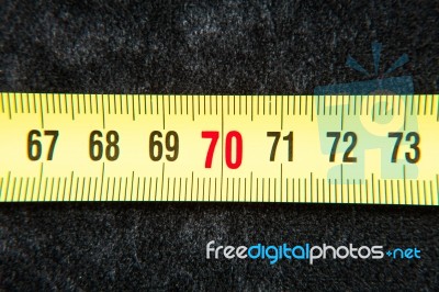 Centimeters Near A Tape Measure On The Number Seventy Stock Photo