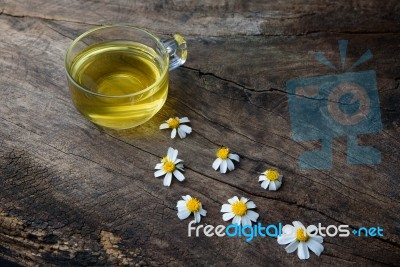 Chamomile Tea And Chamomile Flower On Old Wooden Table Stock Photo