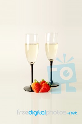 Champagne Flutes With Strawberries Stock Photo