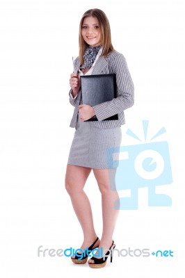 Charming Business Woman Standing And Holding Her Office File Stock Photo