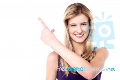 Charming Female Model Pointing Away Stock Photo