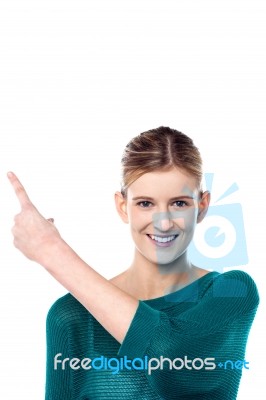 Charming Female Model Pointing Away Stock Photo