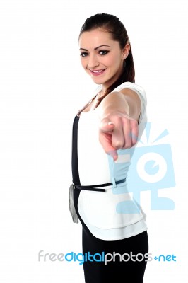 Charming Girl Pointing Towards You Stock Photo