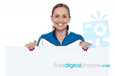 Charming Woman Holding Blank Whiteboard Stock Photo