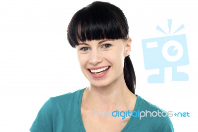 Charming Young Female Flashing An Impressive Smile Stock Photo