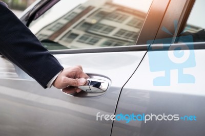 Chauffeur S Hand On Handle. Close-up Of Man In Formal Wear Openi… Stock Photo