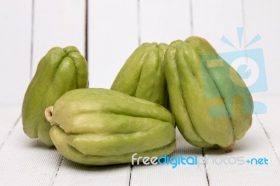 Chayote Fruit On White Wood Background Stock Photo