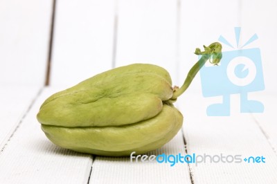 Chayote Fruit On White Wood Background Stock Photo