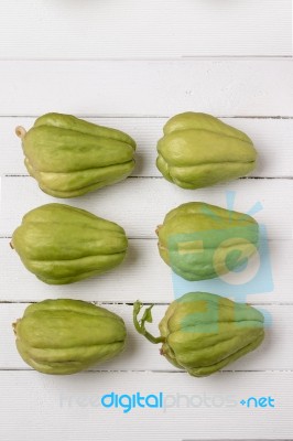 Chayote Fruit On White Wood Background Stock Photo