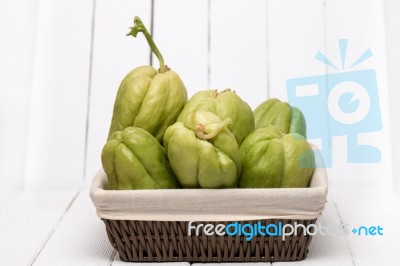 Chayote Fruit On White Wood Background Stock Photo