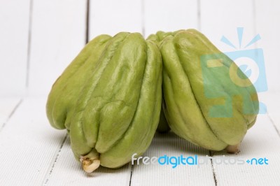 Chayote Fruit On White Wood Background Stock Photo