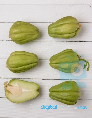 Chayote Fruit On White Wood Background Stock Photo