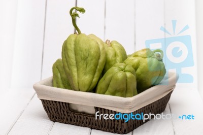 Chayote Fruit On White Wood Background Stock Photo