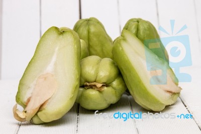 Chayote Fruit On White Wood Background Stock Photo