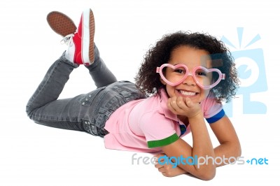 Cheeky Expression Of A Relaxed Young Girl Stock Photo