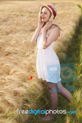 Cheerful Beautiful Young Blonde Girl In White Dress With Straw H… Stock Photo