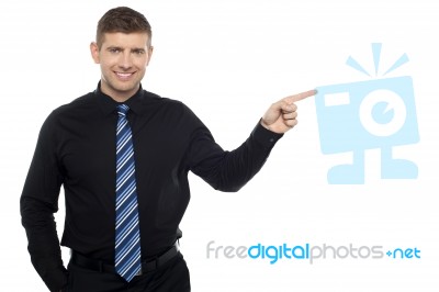 Cheerful Business Consultant Pointing At The Copy Space Area Stock Photo