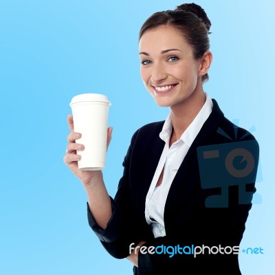 Cheerful Business Lady Holding Beverage Stock Photo