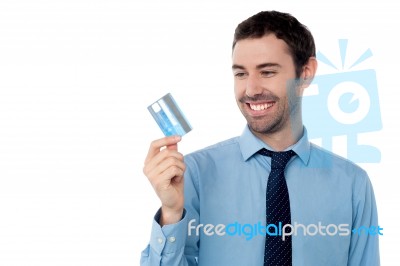 Cheerful Businessman Holding Credit Card Stock Photo