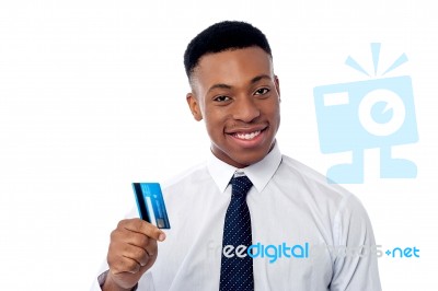 Cheerful Businessman Holding Credit Card Stock Photo