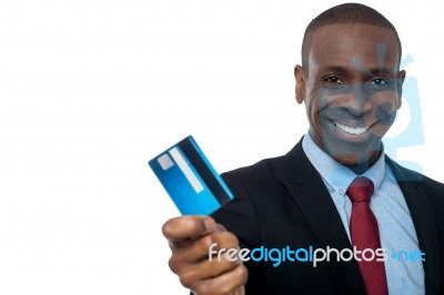 Cheerful Businessman Holding Credit Card Stock Photo