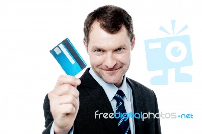 Cheerful Businessman Holding Credit Card Stock Photo