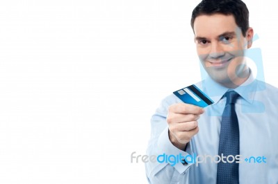 Cheerful Businessman Holding Credit Card Stock Photo