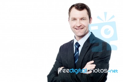 Cheerful Businessman With Arms Folded Stock Photo