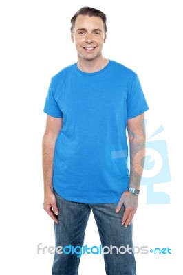 Cheerful Calm Male Model Posing In Trendy Casuals Stock Photo