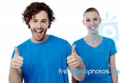 Cheerful Couple Holding Thumbs Up Stock Photo