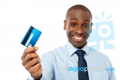 Cheerful Executive Holding Credit Card Stock Photo