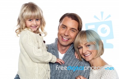 Cheerful Family Of Three Posing For Camera Stock Photo