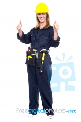 Cheerful Female Architect Flashing Double Thumbs Up Stock Photo