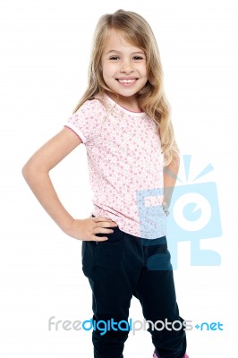 Cheerful Girl Child With Hands On Waist Stock Photo