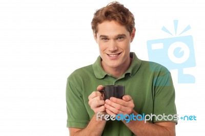 Cheerful Guy Enjoying Hot Beverage Stock Photo