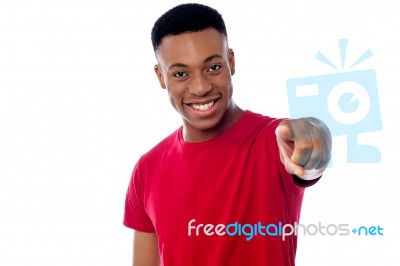 Cheerful Guy Pointing Towards Camera Stock Photo