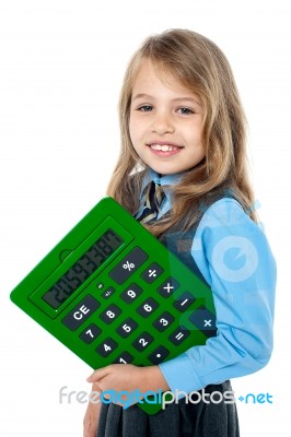 Cheerful Kid Holding Big Green Calculator Stock Photo