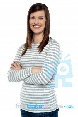 Cheerful Lady In Casual Wear Striking A Pose Stock Photo